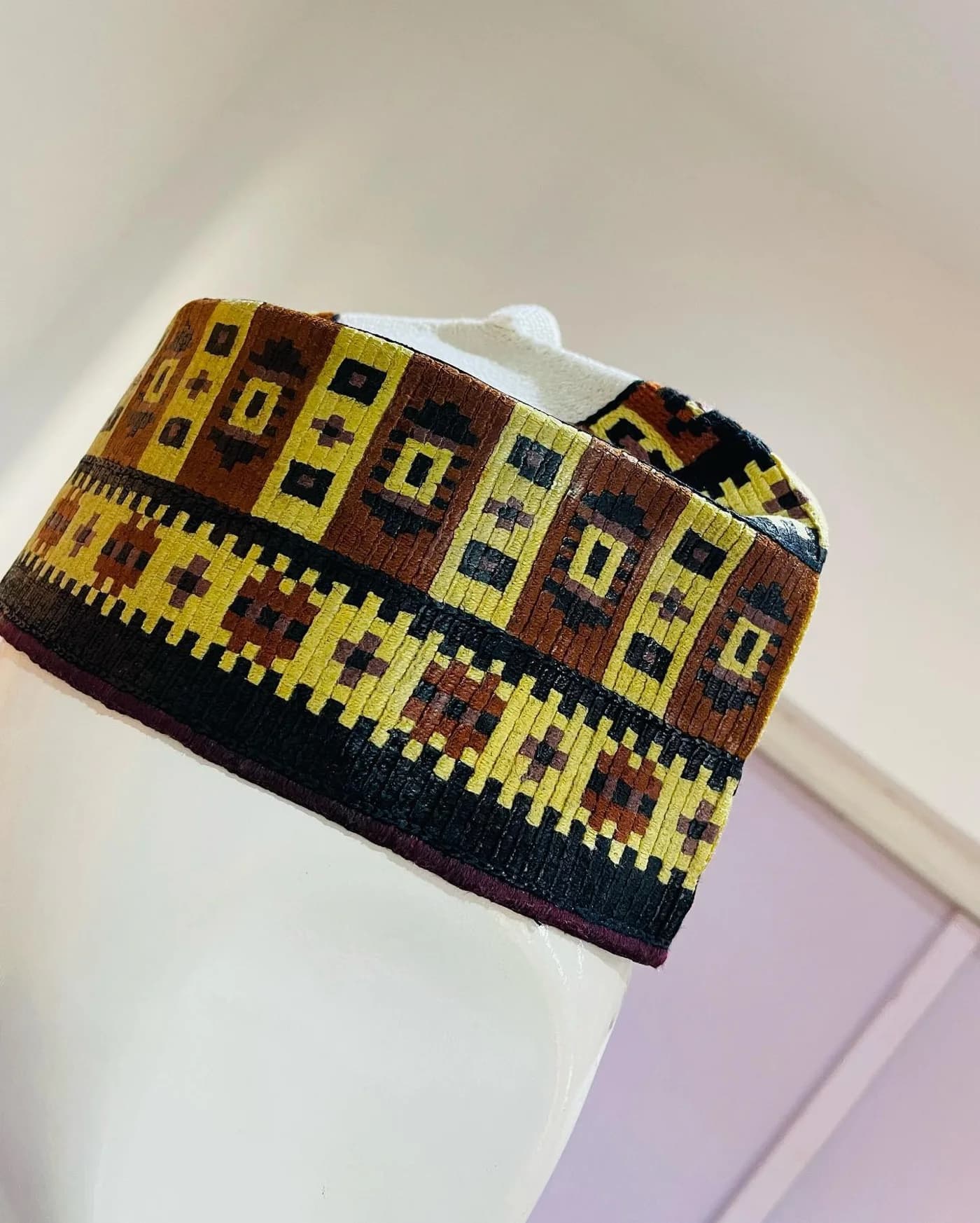 Woven cap in gold, brown and black