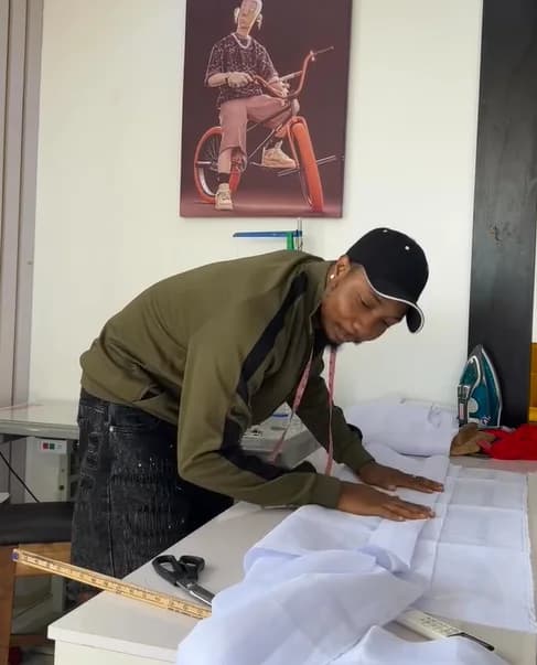 Drafting a pattern on white fabric