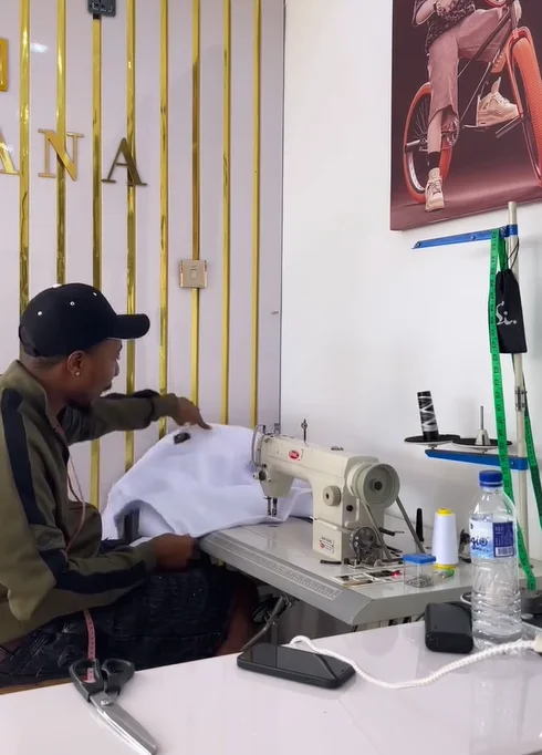 Feeding white fabric through the machine
