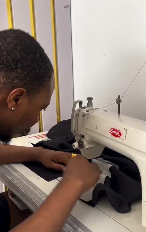 Stitching a black seam by hand and machine