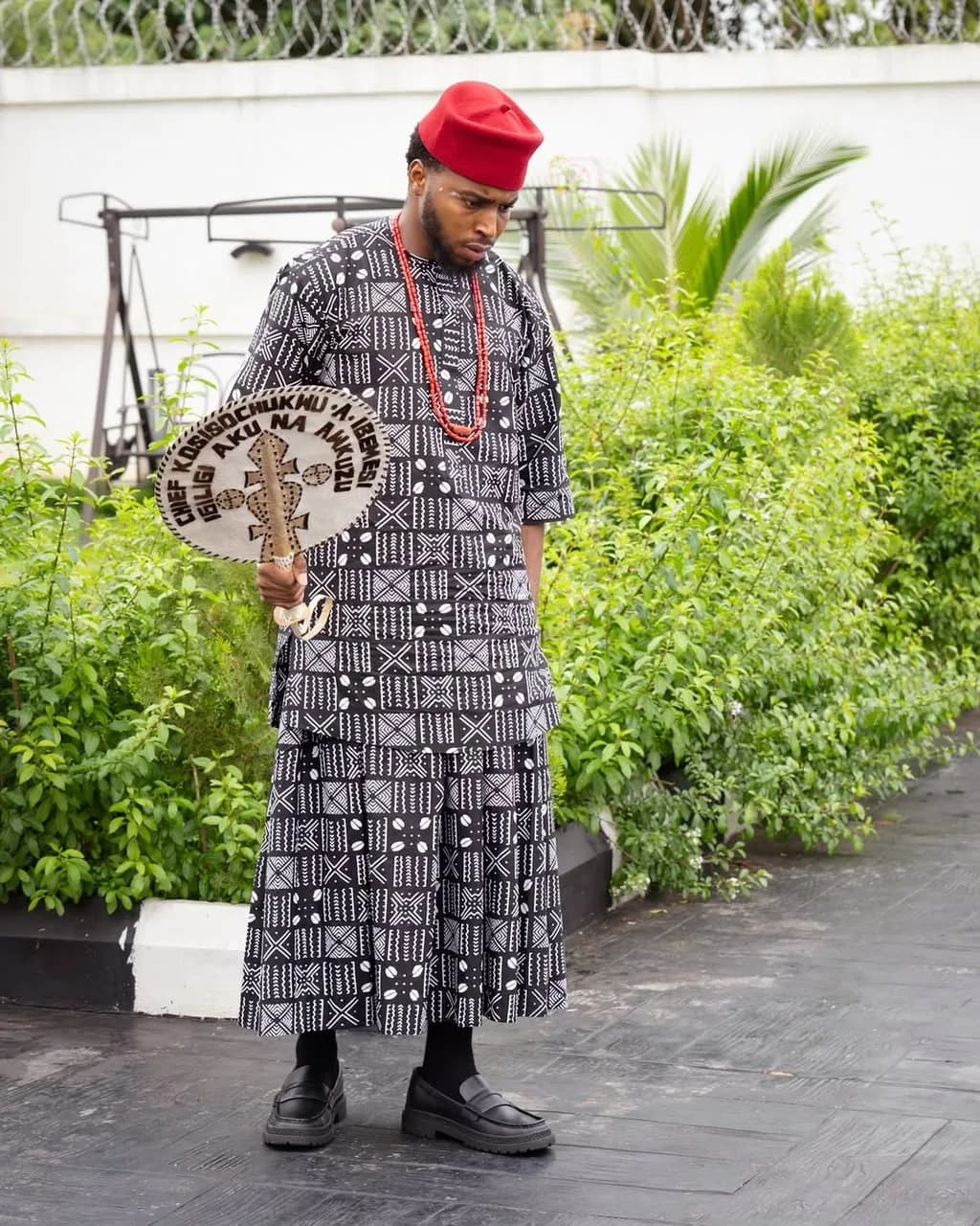 Grey wrapper and shirt with a beaded hand fan