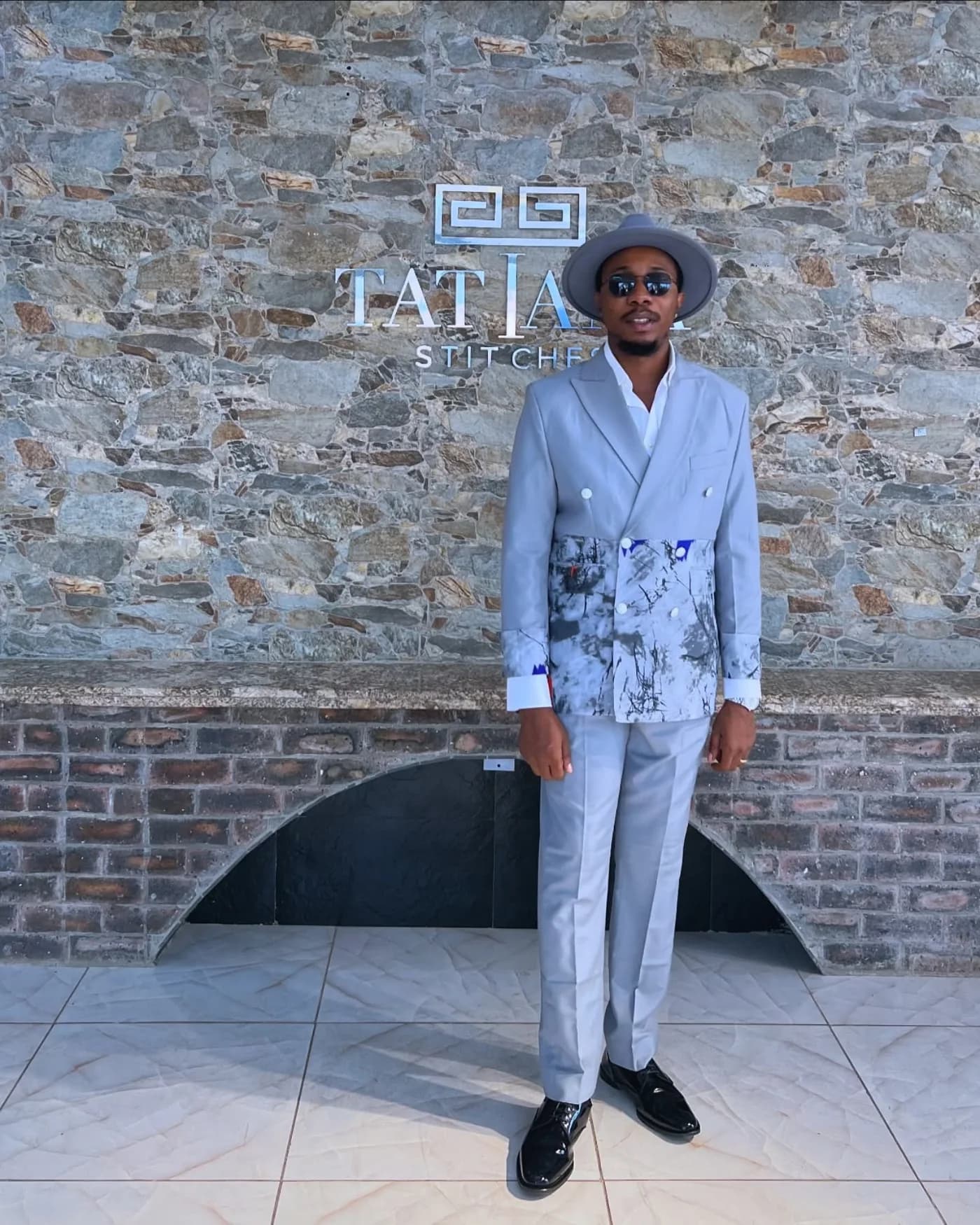 Pale grey double breasted suit with floral embroidery